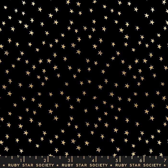 Cotton quilting fabric pattern called 'Mini Starry in Black Gold'. Part of the 'Starry' fabric collection. Designed by Ruby Star Society for fabric company Moda Fabrics. SKU: RS4110 27M. 44-45 inch width.