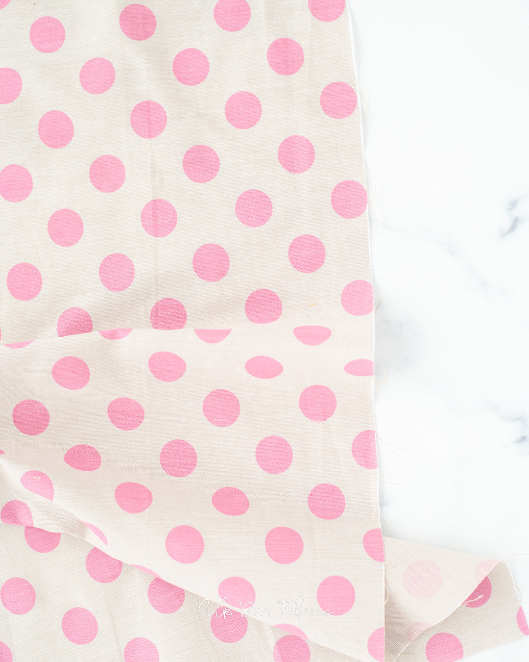 Chambray quilting fabric pattern called 'Pink'. Part of the 'Chambray Dots' fabric collection. Designed by Tilda Solids for the Tilda Solids fabric company. SKU: 160054. 44-45 inch width.