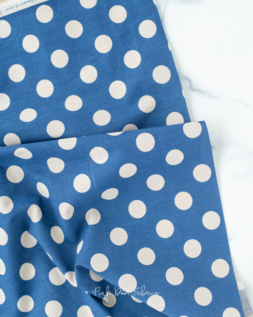 Chambray quilting fabric pattern called 'Denim'. Part of the 'Chambray Dots' fabric collection. Designed by Tilda Fabrics for the Tilda Fabrics fabric company. SKU: 160057. 44-45 inch width.