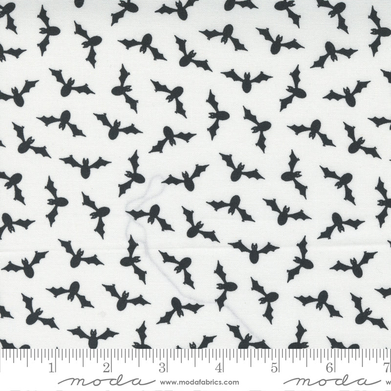 Cotton quilting fabric pattern called 'Wing Ding in White Ghost'. Part of the 'Too Cute to Spook' fabric collection. Designed by Me and My Sister Designs for fabric company Moda Fabrics. SKU: 22423 14. 44-45 inch width.