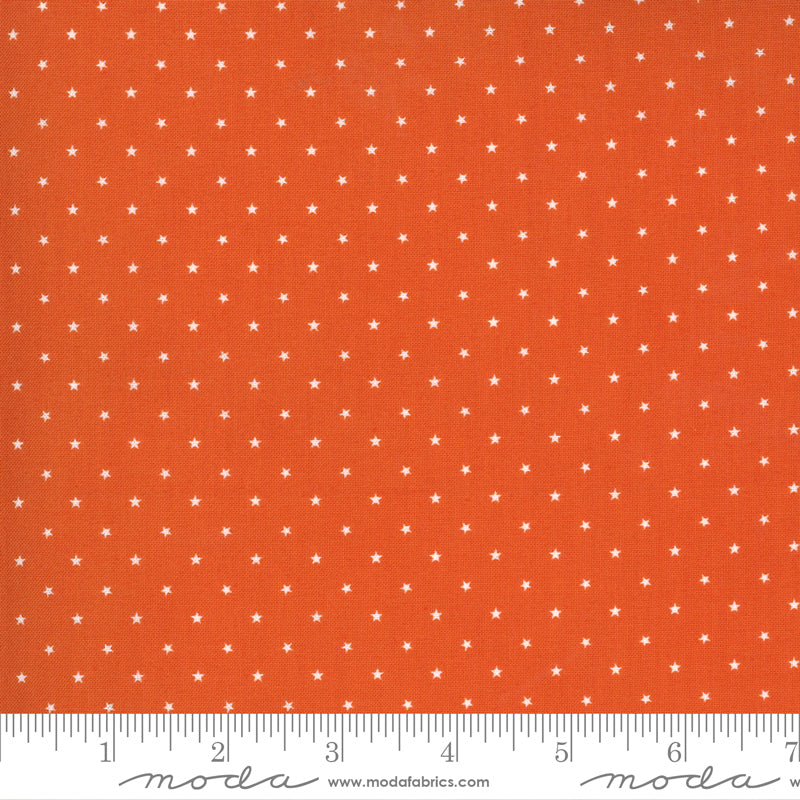 Cotton quilting fabric pattern called 'Tiny Stars in Pumpkin'. Part of the 'Midnight Magic 2' fabric collection. Designed by April Rosenthal for fabric company Moda Fabrics. SKU: 24106 13. 44-45 inch width.