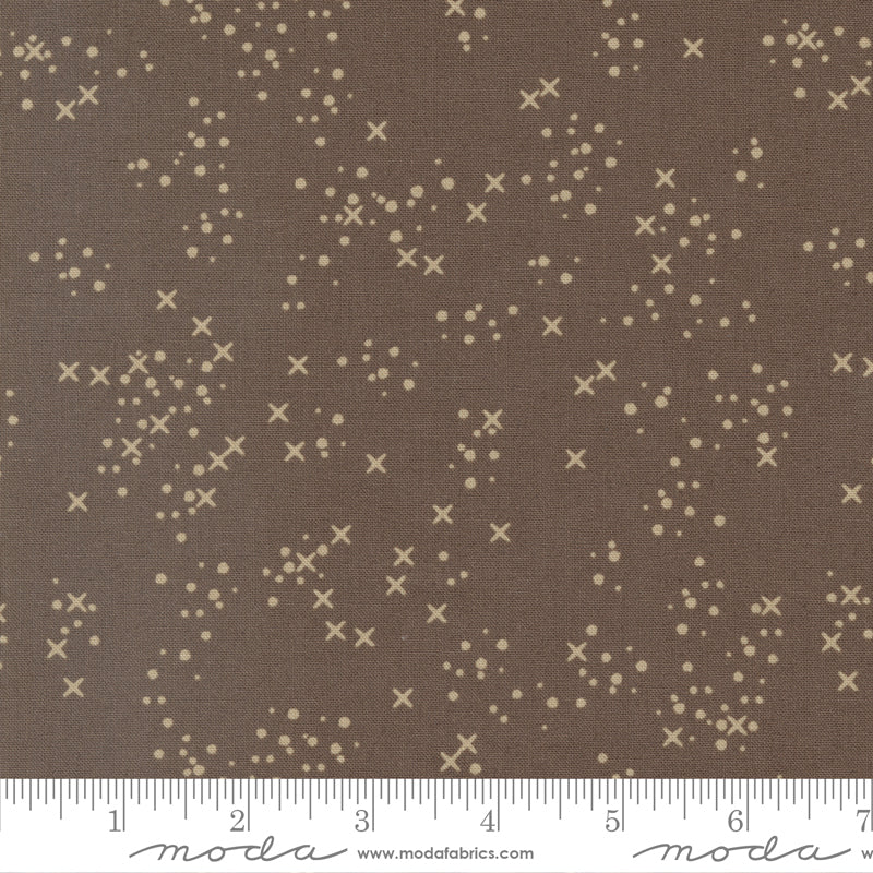 Cotton quilting fabric pattern called 'Stitch Confetti in Mud Pie'. Part of the 'Dawn on the Prairie' fabric collection. Designed by Fancy That Design House for fabric company Moda Fabrics. SKU: 45577 15. 44-45 inch width.