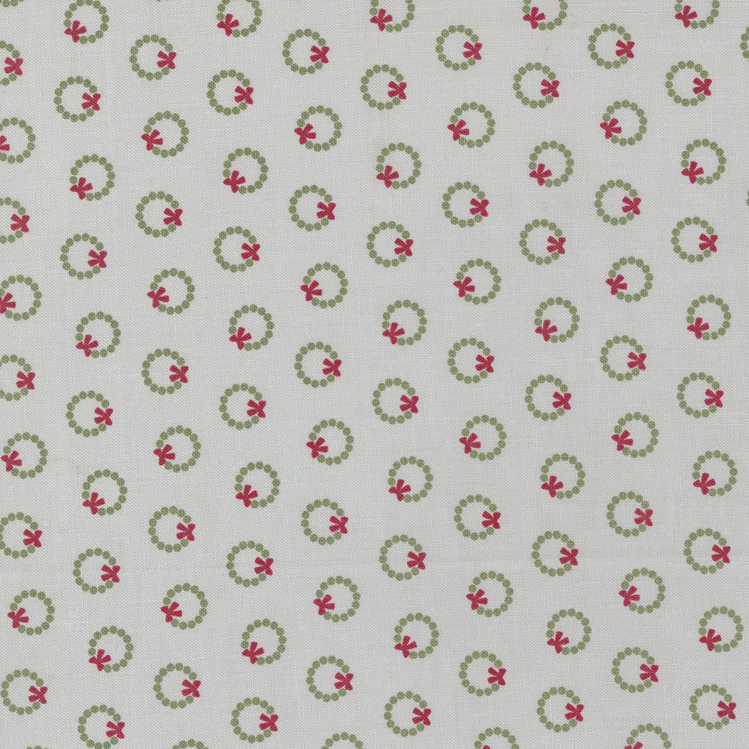 Cotton quilting fabric pattern called 'Wreath Dot in Silver'. Part of the 'Christmas Eve' fabric collection. Designed by Lella Boutique for fabric company Moda Fabrics. SKU: 1199427. 44-45 inch width.