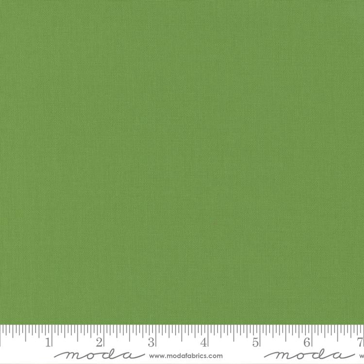 Cotton quilting fabric pattern called 'Fresh Grass'. Part of the 'Bella Solids' fabric collection. Designed by Moda Fabrics for fabric company Moda Fabrics. SKU: 9900 228. 44-45 inch width.