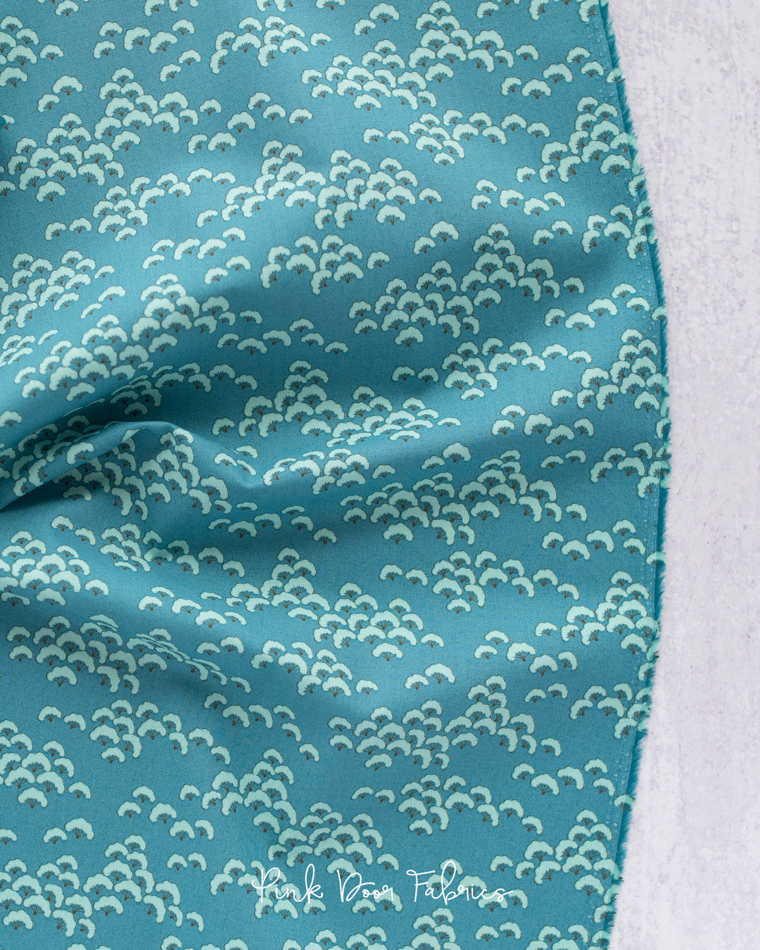 Cotton quilting fabric pattern called 'Cottonbloom in Petrol'. Part of the 'Bloomsville' fabric collection. Designed by Tilda Fabrics for fabric company Tilda Fabrics. SKU: 100513. 44-45 inch width.