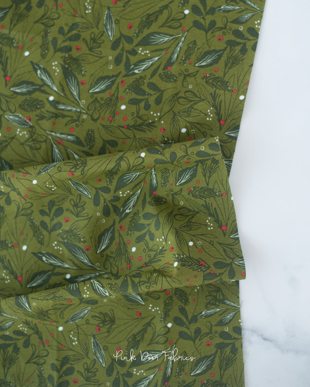 Cotton quilting fabric pattern called 'Winter Foliage in Sage'. Part of the 'Cheer & Merriment' fabric collection. Designed by Fancy That Design House for fabric company Moda Fabrics. SKU: 45534 16. 44-45 inch width.