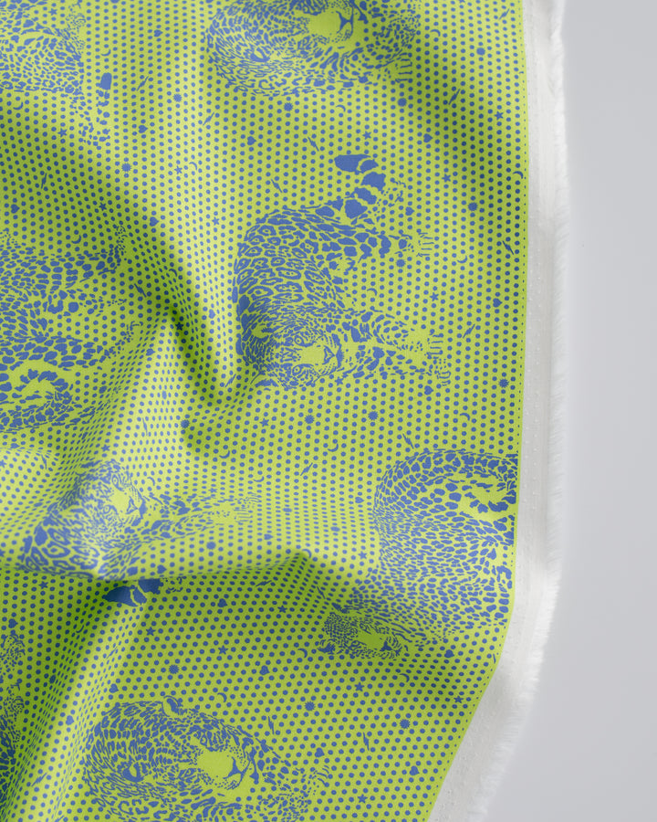 Cotton quilting fabric pattern called 'Lil' Jaguars in Kiwi'. Part of the 'Daydreamer' fabric collection. Designed by Tula Pink for fabric company Free Spirit Fabrics. SKU: PWTP174.KIWI. 44-45 inch width.