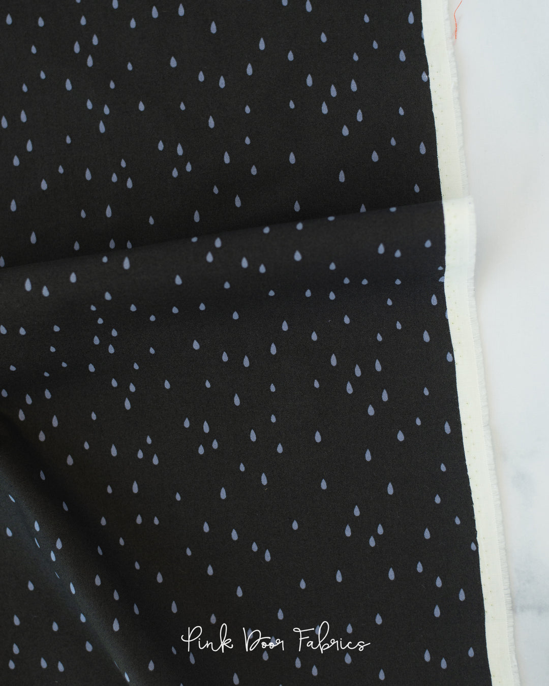 Cotton quilting fabric pattern called 'Rain in Black'. Part of the 'GhostTown' fabric collection. Designed by Dana Willard for fabric company Figo Fabrics. SKU: 90523-99. 44-45 inch width.