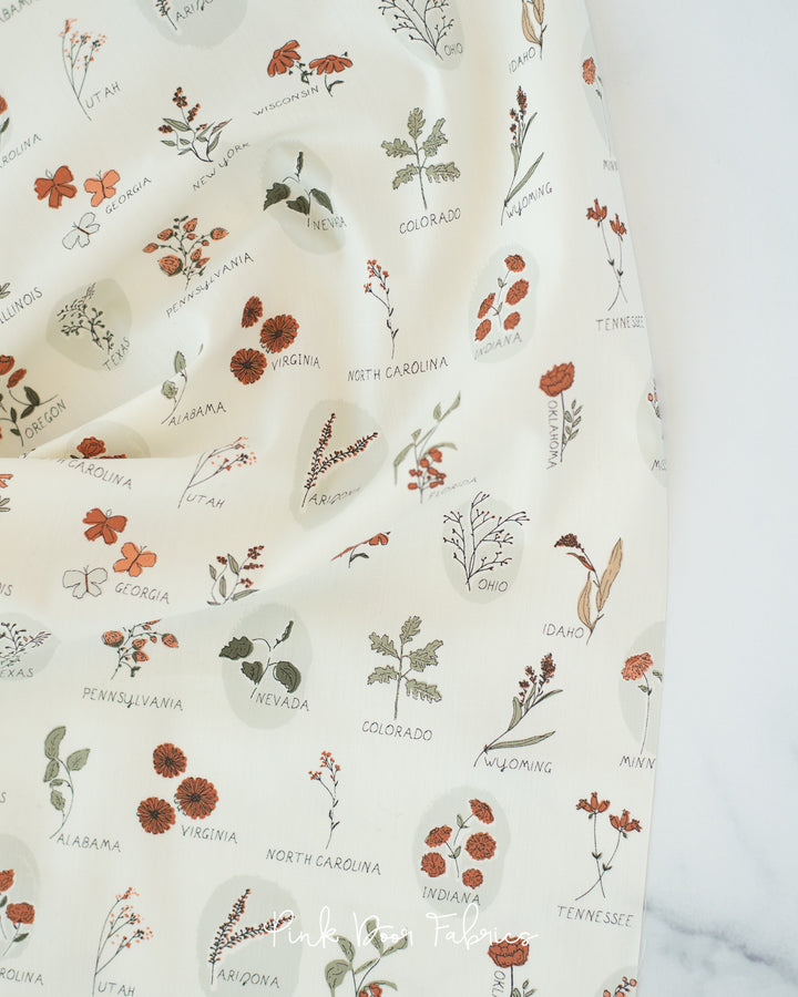 Cotton quilting fabric pattern called 'Roadside Wildflowers Three'. Part of the 'The Season of Tribute: Roots of Nature' fabric collection. Designed by Bonnie Christine for fabric company Art Gallery Fabrics. SKU: TRB-3005. 44-45 inch width.